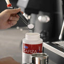 Cafiza2 powder in use during commercial machine backflush